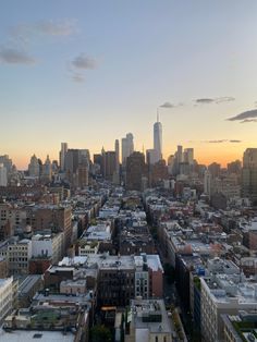 an aerial view of the city skyline at sunset, with skyscrapers in the background