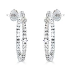 These 18kt white gold hoop earrings showcase 1.93cts of sparkling round diamonds, with the exquisite inside out diamond look that make them elegant and eye-catching. Handcrafted in Italy by ZYDO Italian Jewelry.Diamond Quality: Color F, Clarity VSDiamond Carat Weight: 1.93Dimension: Diameter: 1 1/4 in. - Rows Width: 1/8 in. to 1/16 in. White Gold Hoop Earrings, Round Diamond Earrings, White Gold Hoops, Italian Jewelry, Pendant Rings, Peek A Boo, Ring Collections, Boutique Jewelry, Jewelry Creation