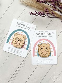 two stickers with the words pocket hug and an image of a bear on it