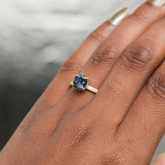 Indulge in the ethereal beauty of this 1.72ct round, color-shifting Songean sapphire! From purple-grey to teal blue depending on the light, this totally natural and ethically sourced gemstone will mesmerize. 7.3x4.51mm with some internal silk, visible from certain angles. Enjoy a timeless, elegant style with this stunning flat band 4-prong solitaire cast in 18k recycled yellow gold. The smooth, polished design measures 2mm wide for a classic yet modern look that's oh-so-comfortable to wear. Plus Celestial Blue Sapphire Ring For Formal Occasions, Blue Celestial Sapphire Ring For Formal Occasions, Modern Sapphire Jewelry With Prong Setting, Celestial Sapphire Ring For Anniversary, Formal Blue Sapphire Celestial Ring, Blue Fusion Style Round Rings, Blue Solitaire Round Cut Jewelry, Blue Diamond Solitaire Jewelry, Modern Blue Sapphire Ring With Round Cut