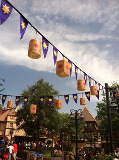 some paper lanterns are hanging from a line