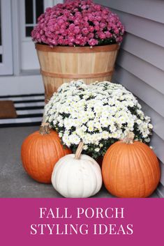 flowers and pumpkins are sitting on the porch