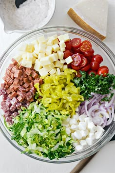 the ingredients for this salad are in a glass bowl, ready to be mixed together