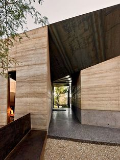 an entrance to a building with concrete walls