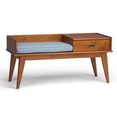 a wooden desk with a blue cushion on it and drawers underneath the drawer, in front of a white background