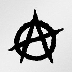 a black and white photo of an anarchy symbol