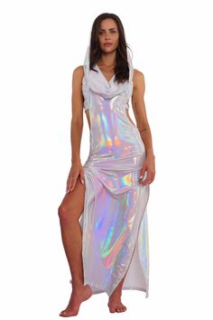 Step into the spotlight and unleash your inner goddess with the Atlantis holographic white maxi dress. Made with lightweight, prismatic spandex that gently hugs your curves and drapes beautifully, this dress shimmers and shines as you move, capturing everyone's attention. Whether you're dancing under the stars or soaking up the sun, this festival maxi dress is guaranteed to elevate your ethereal vibes. FEATURES: Maxi Length High side slits for ease of movement Cowl neck with voluminous hoodie Sl We Are Festival, Rave Outfit, White Maxi Dress, Inner Goddess, Streetwear Shop, Shimmer N Shine, White Maxi, Under The Stars, Rave Outfits