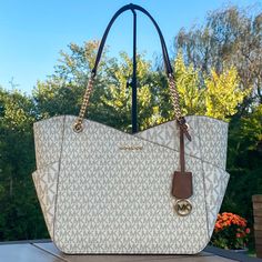 Michael Kors Jet Set Travel Large X Chain Shoulder Tote New With Tags Color: Vanilla Gold Tone Hardware Top Zip Closure Double Straps With Approx. 10” Drop Exterior: 1 Front Pocket Interior: 1 Zip Pocket And 2 Slip Pockets Approx. 15.6”Wx11”Hx5.5”D Michael Kors White Shoulder Bag With Chain Strap, Large Drawstring Bag, Large Tote Purse, Michael Kors Tote Bags, Leather Tote Purse, Red Tote, Mk Bags, Large Leather Tote, Gold Bag