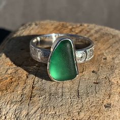 Celtic design sterling silver Cornish sea glass statement ring. The sea glass is a rich green colour, almost velvetine in appearance, it sits on a 4 mm wide patterned silver band. The Celtic knot design adds a sympathetic embellishment to the gorgeous green blue sea glass.  Ring size: UK size R.  USA size 9.  Inside diameter 19 mm The sea glass colour is a green blue, this colour glass dates to the late 1800's early 1900's.  The ring is presented in a jewellery box tied with a pretty satin ribbon. FREE POSTAGE  1st Class. Seaglass Rings, Silver Celtic Rings, Celtic Ring, Sea Glass Ring, Celtic Knot Designs, Artisan Rings, Celtic Design, Celtic Rings, Sea Glass Pendant