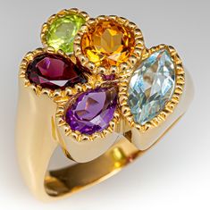 This striking freeform style ring is fancy bezel set with one (1) amethyst, citrine, peridot, blue topaz and rhodolite garnet. The ring measures 18.9mm at the top, rises 6.0mm above the finger, tapering to 3.4mm wide and 1.1mm thick at the base of the shank. This ring is currently a size 9. Vintage Garnet Rings, Citrine Rings, Amethyst Rings, Rhodolite Garnet Ring, Multi Gemstone Ring, Citrine Jewelry, Citrine Stone, Citrine Ring, Rhodolite Garnet