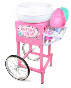 a cotton candy machine on wheels with a pink pom - pom in it