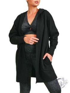 Keep yourself warm (and stylish) in this open-front cardigan. With its longline silhouette, hoodie, long sleeves with thumb holes, and luxurious fleece inner lining, this cardigan is your go-to for when temperature drops. Model in Brick is 5'7", a size 16, and is wearing a 1XL. Fabric: 68.5% polyester, 28.5% cotton, 3% spandex. Comfy Solid Outerwear For Fall, Comfy Fall Outerwear In Solid Color, Comfy Solid Color Fall Outerwear, Winter Loungewear Outerwear With Open Front, Cozy Stretch Outerwear With Ribbed Cuffs, Comfy Long Sleeve Winter Cardigan, Long Winter Outerwear For Loungewear, Cozy Fit Athleisure Hooded Jacket For Fall, Athleisure Cozy Fit Hooded Jacket For Fall