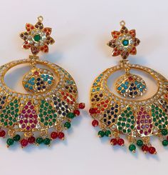 High end quality and beautiful design. Gold polished for lasting shine.  This piece is a showstopper and a must have piece in your collection. Luxury Multicolor Chandbalis For Festivals, Fusion Chandbali Earrings With Meenakari, Fusion Style Chandbali Hoop Earrings For Celebration, Chandbali Fusion Hoop Earrings For Celebration, Fusion Chandbali Meenakari Earrings, Multicolor Chandbali Jewelry With Peacock Design, Kundan Chandbali Fusion Danglers, Fusion Style Hoop Earrings For Festivals And Celebrations, Fusion Meenakari Chandbali Earrings