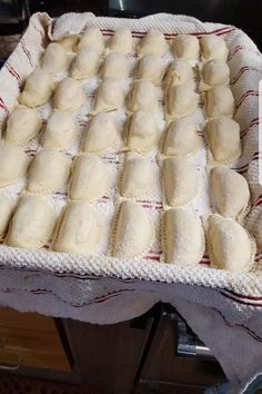 a pan filled with dough on top of a table