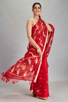 The charm of this red organza Banarasi saree is sure to leave everyone awestruck! It is enhanced with silver golden zari work and comes with a blouse piece. Disclaimer: The shown stitched blouse on the model is for display purpose only. The saree comes with a matching blouse piece and finished with fall and piko. Red Pre-draped Saree With Sheer Dupatta For Puja, Red Pre-draped Saree With Cutdana For Celebrations, Red Traditional Wear With Zari Work In Tissue Silk, Red Organza Pre-draped Saree With Cutdana, Red Organza Saree With Cutdana, Red Dupatta With Zari Work In Tissue Silk, Red Organza Pre-draped Saree With Zari Work, Red Tissue Silk Pre-draped Saree For Diwali, Festive Red Tissue Silk Dupatta