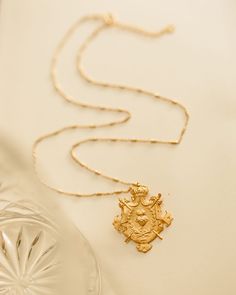 The Crown and Scared Heart Necklace has the protection of the shield and hearts of many. The wearer will surely wear this proud and protected. Vermeil 18k gold matte finished plated silver pendent 30x33mm and chain 20 inches long. Vintage Shield-shaped Jewelry Gift, Engraved Shield Jewelry For Gift, Engraved Shield-shaped Jewelry For Gifts, Engraved Shield-shaped Jewelry Gift, Gift Engraved Shield Jewelry, Heirloom Coat Of Arms Jewelry For Gift, Heirloom Coat Of Arms Jewelry As Gift, Scared Heart, Cottage Core Jewelry