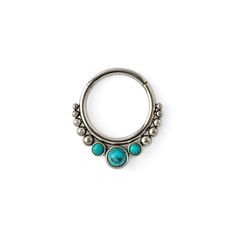 a pair of turquoise stone and silver hoop earrings on a white background with space for text