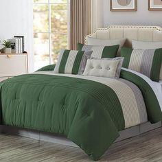 a green and white bed in a bedroom