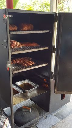 some food is being cooked on an outdoor grill