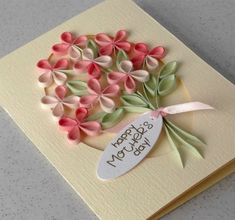 a handmade birthday card with pink and green flowers