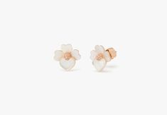 handcrafted of rose gold-tone metal and mother-of-pearl shell our precious pansy collection is true to its name. and these studs are designed with lots of thoughtful details: like the sparkly crystal centers and heart-shaped petals. did you notice the larger ones? they're a nod to our signature mark. | Kate Spade Precious Pansy Studs, Cream/Rose Gold Spade Earrings, Kate Spade Earrings, Cream Roses, Kate Spade Jewelry, Pearl Shell, Pansies, Gold Tone Metal, Kate Spade New York, Mother Of Pearl