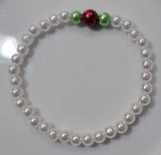 Christmas theme pearl bracelet Festive Adjustable White Pearl Bracelet, Festive White Pearl Bracelets, Elegant Beaded Bracelets For Christmas Gift, Elegant Beaded Bracelets As Christmas Gifts, White Pearl Bracelets For Festive Occasions, Adjustable White Pearl Bracelet For Festive Occasions, Elegant White Bracelets For Holiday, White Round Bead Bracelets For Holiday, Elegant Adjustable Beaded Bracelets For Christmas