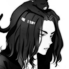 a woman with long hair and a cat on her head