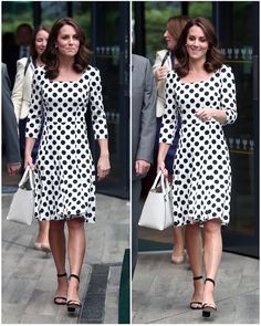 a woman in a polka dot dress is walking down the street