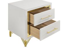 two white drawers with gold handles on each side and one drawer open to show the contents