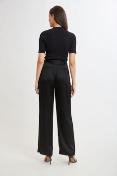 Slip into our Satin Pleated Pants. With front pleats and a removable satin belt, the unique patina and meticulous fit make these pants a standout. Pair them with our Satin Draped neck top or Matte Jersey Knit for a monotone column of refined style. Limited Edition 50th Anniversary Collection Elie Tahari Exclusive Satin Wide Leg Pleated Pant with Self Belt 80% Acetate, 20% Polyester Runs true to Size Measurements: 13.5"L Front Rise, 33"L Inseam (approx. length for a size 6) Model is 5'9" and wear Silk Wide Leg Bottoms With Belt Loops, Silk Wide Leg Pants With Belt Loops, Wide Leg Silk Pants With Belt Loops, Evening Wide Leg Belted Bottoms, Sleek Silk Bottoms For Work, Sleek Satin Pants For Work, Silk Trousers With Belt Loops, Sleek Silk Pants For Workwear, Sleek Wide Leg Pants For Evening With Belt Loops