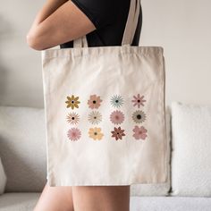 This Floral Tote Bag is a stylish upgrade to reusable tote bags. This Flowers canvas tote bag make a great reusable tote for yourself or as a gift tote for plant lovers. ⚡ USA fast delivery. We deliver within a week. ⚡ Our Tote Bags are made with 100% cotton sheeting. Add their reinforced handle stitching to the mix, and you got a reliable bag rich in both practicality and durability. These durable totes are crafted with a last technological DTG printer for a vibrant flawless finish. Tote bags w Daily Use Flower-shaped Bag With Removable Pouch, Daily Use Flower-shaped Bags With Removable Pouch, Beige Flower-shaped Shopping Bag, Eco-friendly Flower Shaped Shoulder Bag For Everyday Use, Beige Flower-shaped Canvas Bag For Daily Use, Eco-friendly Flower-shaped Shoulder Bag For Everyday Use, Eco-friendly Flower-shaped Everyday Bag, Eco-friendly Everyday Bags With Floral Print, Eco-friendly Rectangular Bag With Floral Print