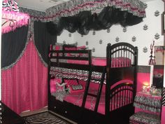 a bedroom with two bunk beds and zebra print curtains on the windowsills,