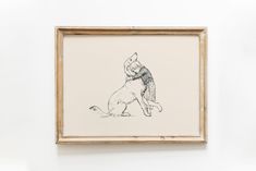 a black and white drawing of a dog sitting on its hind legs in a wooden frame