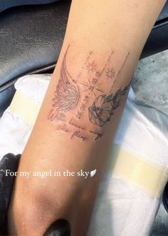 a person with a tattoo on their leg that has an angel and stars on it