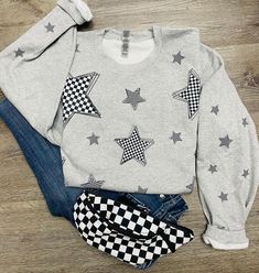 Checkered stars sweatshirt. Checkered stars on the front and sleeves. Unisex fit that runs true to size. Winter Crew Neck Sweatshirt With Star Print, Winter Star Print Crew Neck Sweatshirt, Cotton Long Sleeve Sweatshirt With Star Patch, Trendy Long Sleeve Star Print Sweatshirt, Winter Cotton Tops With Star Patch, Winter Cotton Top With Star Patch, Casual Sweatshirt With Star Patch For Fall, Casual Fall Sweatshirt With Star Patch, Winter Cotton Sweatshirt With Star Print