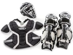 the catcher's gear is laid out on top of each other, including gloves and pads