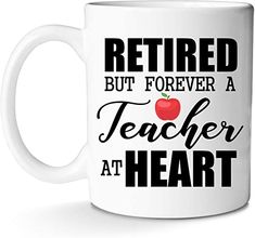 a white coffee mug with the words retired but forever teacher at heart in black lettering