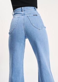 This is a super high-rise, wide leg jean, made with a comfort denim. Fits true to size. The Sailor Jean: High rise, slim fit with a sailor wide leg Tight around the seat but will soften with wear Features Rolla's signature back pockets & sailor style patch front pockets Specially angled and shaped in the back for a truly peachy looking butt Zip closure Made with vintage gold toned hardware Rise: 31 cm / 12 inch Inleg: 74cm / 29 in Hem: 58cm / 22 inch *Measurements for size 26 The Wash: Lilah blu Sailor Jeans High Waist, Vintage High-rise Flare Jeans With Pockets, Rollas Sailor Jean, High-rise Jeans In Washed Blue With Hip Pockets, High-waist Blue Rigid Denim Bottoms, Sailor Jean, Sailor Fashion, Activewear Sets, Skirt Jumpsuit