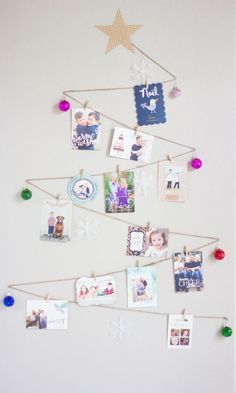 a christmas tree with pictures hanging from it