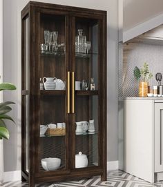 a glass door cabinet in the middle of a kitchen with black and white tile flooring