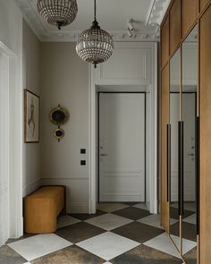 the hallway is clean and ready for guests to use it as an entrance way in this house