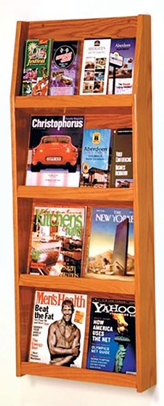 a wooden book shelf filled with books and magazines