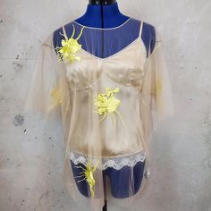 Brand New With Tags Never Worn. Helmet Lang Embroidered 2 Piece Blouse Yellow Embroidery Size Small. Sheer Mesh Top With Neutral Lace Cami Underneath. Cami Has Adjustable Straps. Can Wear Together Or Separate. Cami Is A Size Small. Small Hole In Mesh. (Shown In Photo). Can't See It When Being Worn. No Returns. Embroidered Silk Tops For Summer, Summer Embroidered Gold Tops, Gold Embroidered Summer Tops, Embroidered Gold Tops For Summer, Spring Embroidered Gold Top, Embroidered Gold Top For Spring, Yellow Top For Spring Wedding, Yellow Embellished Party Tops, Gold Embroidered Top For Spring