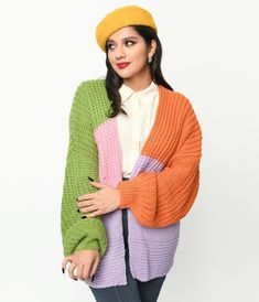 This delightful piece boasts a mesmerizing blend of colors, including green, pink, purple, and orange. Its eye-catching color block design is sure to turn heads wherever you go. Made from a cozy knit fabric, this open cardigan is perfect for both chilly evenings and stylish layering during the day. With its long balloon sleeves adding a touch of whimsy to your outfit, you'll feel like floating on cloud nine!Available in sizes S-L while supplies last. Multicolor Color Block Sweater For Spring, Multicolor Knitted Outerwear For Layering, Multicolor Fall Sweater For Layering, Trendy Multicolor Soft Knit Sweater, Multicolor Color Block Sweater For Layering, Multicolor Sweater For Fall Layering, Multicolor Acrylic Sweater For Fall, Oversized Multicolor Sweater For Layering, Spring Orange Color Block Sweater