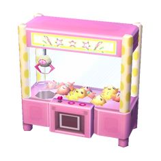 a pink and yellow toy claw game machine