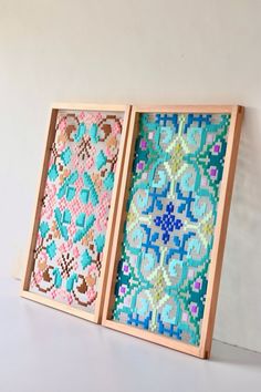 two wooden frames with different designs on them