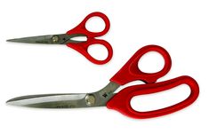 two pairs of red scissors on a white background