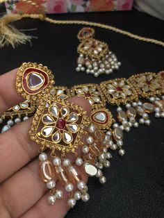 A regal set that has the delicacy, elegance and grace to make you the star of any event! A stunning new addition of kundan stones mala bridal set Beautiful combination of kundan and hand painted meena work! Set included: choker, mala, earrings Hand crafted and gold plated kundan indian/pakistani jewelry Material:brass,stone,gemstone,pearl We bring you casual as well as party wear jewelry which comes with an attractive design and style. It goes well modern and traditional outfits. Visit my websit Chandbali Jewelry With Mirror Work For Wedding, Chandbali Wedding Jewelry With Mirror Work, Elegant Jewelry Sets With Mirror Work For Festivals, Chandbali Mirror Work Jewelry For Wedding, Kundan Chandbali Mala For Wedding, Wedding Kundan Chandbali Mala, Elegant Jewelry Sets With Mirror Work For Gifts, Elegant Festive Jewelry Sets With Mirror Work, Kundan Jewelry With Mirror Work For Ceremonial Occasions