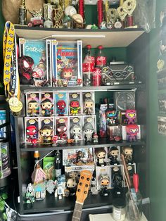 an assortment of toys and other items on a shelf