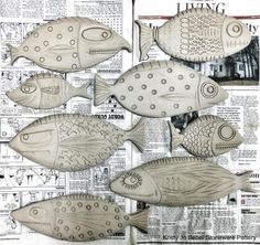 some fish that are sitting on top of a newspaper